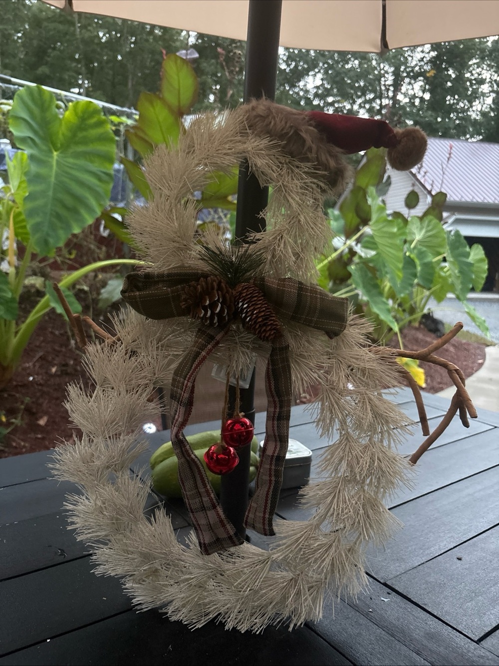 Rustic Cream Pinecone Holiday Wreath with Red Bells and Plaid Bow
